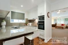  65 Acacia Avenue, North Lambton NSW 2299 Faultless presentation in this impressive FOUR BEDROOM family home which has been meticulously renovated top to bottom! ACCOMMODATION includes Tiled entry & hallway, 4 bedrooms - all with built-in wardrobes, spacious main living room plus additional family/dining area adjoining the new kitchen & laundry, super sized bathroom with a double vanity & 2nd wc. Relax & enjoy the outdoors on the covered back patio or entertain in the covered al fresco dining area. 