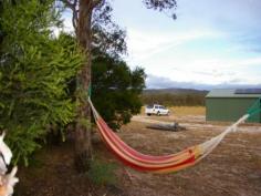  29 Ellerington Lane Amiens Qld 4352 Located just minutes from Stanthorpe this very neat 44 acre block offers privacy and comfort to enjoy the view, the wildlife and all that this district has to offer. The steel framed 28 x 7m house started its life as a shed but has been transformed into a comfortable 2 bedroom home nearly two years ago by a reputable builder with council approval. Featuring extensive insulation throughout, quality carpets and tiles, double glazed windows and doors, wiring for PC network, Foxtel and NBN ready, a 5.25KW Solar System with 21 panels, solar hot water and 2 x 5000 gallon rainwater storage tanks. The property is nearly all fenced with 3 dams (1 springfed), mountain views right across to Bald Rock National Park, walking tracks and an abundance of wild flora and fauna. Offering a lifestyle many only dream of, this property could be yours. Contact Sally Rowen on 0417 633 969 to arrange an inspection. 