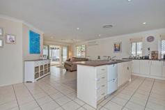  9 Worth Ct Upper Coomera QLD 4209 Welcome to the most jam packed, feature filled, suburban family home 
available on the market. In need of something that fits your family, 
friends, pets and the hobbies... this is the home that fits the bill, 
and it's well worth it! Quality, space, location, price and charming 
family appeal are just a few of the superior features this home is 
packed with. * Four large sized family bedrooms. The spacious 
master has a large walk-in wardrobe, a large private ensuite and windows
 that overlook your private pool area and surrounding bushland. * Impressively well kept and not a thing to do but move in and enjoy easy living. *
 Two large internal living areas comprising of a completely separate 
formal lounge or children's rumpus room at one end of the residence and 
an open plan dining/kitchen combination that overlooks your sheltered 
rear yards. This floor plan has been perfectly planned to provide for 
the various needs of an expanding family. * You will find a huge 
central kitchen that will excite every buyer, equipped with modern 
appliances, great storage space, large counter tops and stylish decor. *
 The bedrooms have also been well arranged, with a separate 4th bedroom 
or home office at the front of the home, this room has sliding doors out
 to the side yard space and is perfect for overseas guests, homework 
area or study. The remaining 2 double sized children's bedrooms are both
 spacious and flooded with natural light. The large master bedroom is 
positioned to the rear of the property and has been fitted with a 
stylish private ensuite and walk-in robe. * Complimenting the whole 
home is a beautiful tranquil private in-ground swimming pool area with 
solar heating, private outlook and adjoining massive undercover alfresco
 area for summer barbeques. * Secluded 1000sqm flat battleaxe block 
that offers wonderful side access, room for a shed, off street parking 
(in addition to the double lockup garage) ideal for boats, caravan or 
any hobby that requires space. * Flawless low maintenance landscaping, flat yard space for the children or pets and no neighbours means absolute privacy! *
 Additional features include: ducted air conditioning, impeccable 
condition, ceiling fans throughout, security screens, rain water tank 
and garden shed just to name a few. *Located in a modern and quiet 
pocket of Upper Coomera, this impeccable home is a wonderful place to 
raise your family. Public transport comes right to estate entrance with 
approximately nine local schools within a 10 minute drive, shops, parks,
 waterways, medical centres, train, M1 motorway, equestrian centres, 
restaurants, child care, public swimming pools, you name it. To top it 
all off, this home is situated in a quiet and family friendly 
cul-de-sac. All in all the most impressive element this home is 
its overall lifestyle appeal and set up to accommodate any buyer's 
needs... a home like this, packed with so many assets will likely draw 
the eye of many buyers, so pick up the phone and arrange an inspection 
soon!   