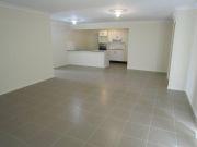  2/12 Prewett Street Upper Coomera Qld 4209 A modern, stylish and spacious, 3 bedroom home with open plan living and dining areas awaits you. There is quality fittings throughout including ceasar stone bench tops, stainless steel appliances including dishwasher. There is an ensuite and walk-in robe to the master and a separate laundry in the garage area. Tinted windows & sliding glass doors add to the comfort of the home as does the quality carpet in the bedrooms and tiles throughout the rest of the home. 