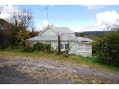 55 Cascade Street, KATOOMBA This property comprises a basic weatherboard and iron house on a treed block of approx. 845m2 in a convenient position, an easy 10 minute walk to town. The home consists of an entry area, lounge room, kitchen with gas cooking, small simple original bathroom and bedroom. In addition, there is a sunroom overlooking the garden. The garden features some lovely fruit trees and the property picks up some good mountain views. This is potentially an affordable acquisition for the investor or first home buyer with plenty of room to further improve the property. ** This property is only available for inspections from Tuesday, 9th September 2014. Please call Theo Poulos Real Estate on (02) 4782 1888 if you would like to make an appointment. 