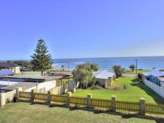  12 Cooranga Rd  Falcon WA 6210 Awesome Ocean views from this property located in the heart of Falcon Bay.   The property features:  4 queen sized bedrooms all with built in robes with the exclusion of the main bedroom as this has a huge walk in robe. There is also a large study or 5th bedroom, 2 full bathrooms and 2 toilets.   Lounge, bar area, family/games, formal dining and meals area, all with views.   The property offers two split system air conditioners.   The kitchen is large and offers island bench, loads of cupboard space including 3 door linen cupboard in hall & under stair case storage.    Outside offers: Two balconies, huge semi enclosed patio, double garage with through access, all on a 1012m2 block.  