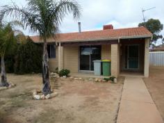  8 Yorrell Way Merredin WA 6415 The front lounge room features a sliding door opening out to the front yard and a slow combustion fireplace and leads you through to the dining room and kitchen area (lino floors). The dining room glass sliding door leads you out to the large rear paved patio area. Down the hallway you will find the three bedrooms all reasonable sizes and the third bedroom has some built in shelving. Tiled bathroom with a shower over the bath tub. Lino to the laundry with a separate toilet. Security screens fitted to all windows. Large back yard with two rear garden sheds. This home is in need of some TLC and renovating but has the potential to be a lovely solid home (the kitchen is the main area that needs renovations and also needs an oven installed). Evaporative air conditioning to the whole house. If you would like to view this property please call Tony or Tiffany at the office on 9574 2917 and we will arrange a time to meet with you on Thursdays when we are in town. 