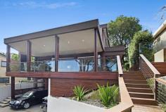  95 Rose Avenue, WHEELER HEIGHTS NSW 2097 Architect designed modern & stylish family home in a quiet & 
private setting.  Living spaces flow out onto an expansive wrap around 
hardwood balcony providing seamless indoor/outdoor living.  These 
outdoor rooms have sloped ceilings to ensure nothing disturbs your view.
  Inside consists of open plan kitchen, lounge & dining area with 
separate media/movie and rumpus rooms.  There are 3 spacious bedrooms 
and 2 stunning bathrooms.  The substantial outdoor living spaces provide
 enough room for alfresco dining, outdoor lounging (including a wall 
mounted TV), a built in spa, level garden for the kids, car parking for 3
 vehicles & huge amounts of storage.  This home is constructed with 
the highest of quality, has nothing for you to do but enjoy the beach 
lifestyle.  It has beautiful leafy views from almost every room, and is 
easy walking distance to shops, schools, transport, parks & golf 
course.  A must to inspect. 