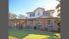    Macquarie Fields NSW   2564 This great three bedroom home is what you have been waiting for. Featuring separate lounge and dining and huge upstairs rumpus with built in wet bar. Including renovated family bathroom and ensuite to main, built in wardrobes, central floor heating downstairs, split system air conditioning, under stair storage and single car garage and carport. The backyard is what this home is all about, with large covered BBQ area that features another bar that overlooks the inground pool. Be quick and do not miss out on your opportunity to own this fantastic property. 