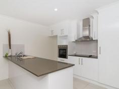  2/41A Eiser Street Harristown Qld 4350 Beautifully finished throughout this duplex unit is ideal for first home buyers, retirees or, with a projected rent return of $350 - $370 per week, astute investors. With high quality fittings and fixtures throughout the unit offers generous built in bedrooms, a well appointed kitchen overlooking the spacious tiled living area that leads on to a private rear patio. Plus the unit has an oversized double lock up garage with storage space and internal access. All Set in an ultra convenient location just a stroll to shops & parks. 2 / 41A Eiser St Fast Facts: 3 generous bedrooms with builtins - main with WIR & ensuite Tiled open plan living areas with reverse cycle air conditioning Well appointed kitchen with Caesar Stone bench tops Attached DLUG and landscaped gardens throughout A must inspect for any buyer looking for great value!   Read more at http://toowoomba.ljhooker.com.au/QJFF4W#tFt34hxh4Ld0XOmk.99 