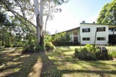  195-199 Beacon Rd North Tamborine QLD 4272 This is a well sized family home and a great kid friendly flat yard also
 has a separate self-contained cottage which would be perfect for 
Grandma or guests.... Main House * 5 bedrooms, all very spacious * 2 bathrooms, one on the living floor plus a 2-way off the master bedroom * Large formal lounge makes an ideal media room * Open plan lounge dining with cathedral ceilings & potbelly stove * Family sized kitchen with island bench and walk in pantry * Large deck upstairs off two of the bedrooms * Wide front veranda Ideal for BBQ's * Double carport plus extra under deck Cottage * One bedroom with ensuite bathroom * Combined lounge dining area * Neat kitchen * Covered veranda * Separate entrance driveway * Separate septic system The cottage is currently rented by a lovely lady who would like to stay if possible but will move on if necessa 
