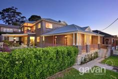  22 Planthurst Road Carlton NSW 2218 Charming family residence with modern finishes Character filled, open spaces and designer finishes, this family home blends together the old and new and has been architecturally designed for those that like to entertain. The home boasts 5 spacious bedrooms, 2 complete with en suites. All rooms have built in wardrobes and main with walk in robe. There is a separate study room which includes a custom built floor to ceiling library with wrap around desk, giving you maximum storage & space. The formal living area comes complete with a sleek wet bar and original fire place. The oversized informal lounge / dining area opens out onto the large undercover entertaining area that then flows onto the lush manicured gardens. The yard is level, secure, private and child friendly. The oversized designer kitchen includes Miele appliances,2 ovens, built in coffee machine, stone bench tops, gas cooking, dishwasher and soft close drawers. Other highlights of the property include high detailed ceilings, timber floorboards, ducted air conditioning, alarm system and private balconies with outlooks of the city. There's also a double lock up garage with remote access. This property is sure to impress and is a rare offering.  5 bedrooms plus study 2 master bedrooms both with en suites Formal and informal living areas Designer finishes throughout / Air con  Double lock up garage with remote access Close to local shops, schools, parks and transport Other Features Air ConditioningBuilt-insClose to TransportDishwasherEntertainment AreaFireplace(s)Internal LaundryLock up GaragePolished Timber FloorsRemote Garage 