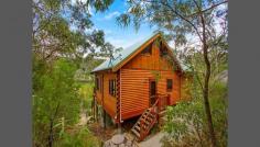  5964 Wisemans Ferry Rd Dharug National Park Gunderman NSW 2775 We believe this wonderful Appalachian Log' home truly has the WOW factor and all the varying lines of the Cathedral Ceilings somehow is inspirational! This home is a Temple' featuring 3 bedrooms (as follows:-) Two large bedrooms downstairs (with built-ins) and a huge mezzanine' Loft that is versatile in as much it could be a wonderful Loft Studio' and huge Master Bedroom or just a huge Loft/Studio, overlooking the living area below from the Balustrade (again what an effect) or just as a Studio! The Kitchen is large, well thought out and of a complimentary design. A huge open plan living/dining area with magnificent views to the Hawkesbury River. This unique hide-away' property is blessed with fabulous River and Bush views, set in its majesty above the World' and yet has an excellent driveway access with ample parking for 3+ Cars and an easy turn-around area. The land area is 986m2 (approx.) of bush-land paradise with this beautiful home perfectly set in its surroundings with the National Park behind. Approx 12kms from Wisemans Ferry overlooking the picturesque Hawkesbury River and roughly only 50mins to Gosford and Hornsby. Rates: $1,045 per year. 