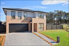  15 Harding Close Ropes Crossing NSW 2760 Lifestyle - A spectacular statement in quality and style, this luxury residence is custom designed and presented as-brand new to deliver the ultimate family entertainer. It offers a superb lifestyle retreat embracing low maintenance in/outdoor living with a relaxing feel to ensure style excellence in a quiet neighbourhood setting just minutes to local schools, shops and the future rail station. Accommodation - No expense has been spared to create one of the area's best properties. Contemporary interiors offer a spacious layout over two light filled levels with generous formal and casual living areas and a level flow to private outdoor spaces. There are four bedrooms including a master with walk-in and ensuite, an upstairs retreat, and a deluxe chef's kitchen with high-end appliances. 