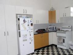  107 Lambeth Street Glen Innes NSW 2370 For Sale $210 000 Looking for a long term investment. This property has three units currently returning $320 per week with a history of low vacancies. Upstairs contains a 2 bedroom unit with eat in kitchen, lounge, bathroom and large balcony. Downstairs contains 2 x 1 bedroom units with kitchen, laundry, bathroom and lounge. All kitchens have been replaced in recent years. New roof. Double block with rear street access for potential future development. Near a new retail district. Potential for rental increases.     
