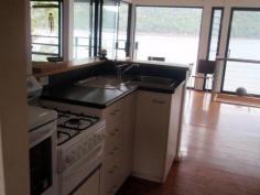  Lot 2 Coba Point Berowra Waters NSW 2082 Delightful river cottage with deep waterfrontage, fully furnished, renovated 2 bedrooms, 1 bathroom, great inside and outside living areas. Located approx. 15 minutes by boat from Residents’ Pontoon – water access only – no road access to house Your own private jetty and pontoon, slow combustion fireplace, wonderful water and bush views. Well set up for permanent living. 