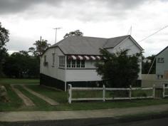  94 Downs Street North Ipswich QLD 4305 MASSIVE 1012SQM -- CLOSE TO CBD This solid neat and tidy Queenslander is not only just a stone's throw to the Ipswich CBD, it is positioned on a rare quarter acre size block! So whether its lifestyle you are chasing or simply your next project (STCA) -- this cracker of a property has potential plus stamped all over it.  Flood free situated back from the street with side access to the expansive rear yard, it is also close to all amenities, quality local schools, transport options and the Riverlink Shopping Centre. It offers such character and charm throughout with stunning polished timber floors, gorgeous lead light windows and those cross breezes traditional of an era bygone. There is also a large sleep out at the front of the home, renovated bathroom plus a large recently renovated eat in kitchen with ample cupboard space. The 2 bay carport has a 5000L water tank and there is loads of storage space underneath where you will also find the laundry area. This property is now vacant -- don't delay your inspections on this! General Features Property Type: House Bedrooms: 2 Bathrooms: 1 Land Size: 1012 m² (approx) Outdoor Features Carport Spaces: 2 Other Features Polished Floors 