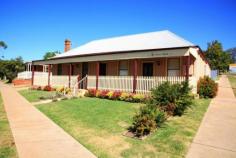  89 Mayne Street Gulgong NSW 2852  $429,000 		 4 			 1 ENDLESS OPPORTUNITIES Here is a rare opportunity to purchase a unique Gulgong landmark. Situated in the heart of Mayne Street is this well presented property that was originally built in the 1870's and tastefully refurbished a few years ago but still showing all of the original character & charm. The property is currently used as guest accommodation and receives a return of approx. $900 pw. The building is zoned commercial and has been used as many things including an art gallery. The layout at the moment is 4 bedrooms plus a study but could be 6 bedrooms or could be 2 bedrooms and a huge lounge and living room. The opportunities are endless and you will need to inspect the property to truly appreciate it.   Inspection Times Contact agent for details Features Downlighting Formal Entry Dishwasher Fully Fenced Open Fireplace Secure Parking Land Size 521 m2 