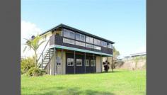  1 Bridge St Lawrence NSW 2460 Situated on the banks of the Clarence River in the peaceful village of Lawrence is this true riverside gem. The home stands on an elevated and enclosed brick foundation offering solidarity and maximizing on a truly unique position. At the base of the house is the large double garage and workshop space with power, lighting, concreted floor and electric roller door. A staircase on the western side of the home leads to the covered and enclosed balcony that overlooks the river. Upstairs are three comfortable bedrooms with carpeted floors. The Master bedroom fronts onto the balcony and has a sliding door providing easy access to it. The dinning and living areas are spacious with the timber floors and tall ceilings offering a homely feeling. The dining room faces and opens onto the balcony and will surely make summer barbecues easy. The kitchen also looks out to the river and is well lit and uncomplicated offering ample storage and prep space. The country style bathroom is also well lit and offers a three way configuration with separate bath, shower, vanity and toilet. 