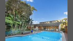 14 Adrian Pl Balgowlah Heights NSW 2093 Luxury Family Home In A Premier Location Situated within a quiet & private cul-de-sac, set back from the street front. This spacious family home offers luxury and convenience with views across to Balmoral Beach and the CBD skyline from the front balcony and master suite. This home offers an abundance of space and high quality finishings spread across two generously proportioned levels. There are 5 double size bedrooms, all with built-in wardrobes and a modern ensuite off the main. The main also offers a private balcony with harbour views. The home offers a modern kitchen with stone bench tops & Miele appliances. The five star solar heated pool with outdoor shower is another feature of this immaculate family home. Access to the large under cover alfresco entertainers deck via full length bi-fold doors leading from the main living space. An entertainers delight, the spacious alfresco space overlooks the manicured level grassed lawns and includes a servery link to the kitchen. This property offers ducted reverse cycle air conditioning, ensuring your comfort across seasonal changes. Further features of this family home include a double garage with additional mezzanine storage level and security intercom 