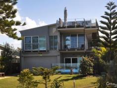  14 Esplanade Noosa North Shore  Qld 4565 A rare opportunity presents itself to purchase an exclusive '40 Mile Beach' absolute beachfront home.  Cooloola National Park envelops this exclusive beach house, which has stunning ocean views and is at the gateway to the World Heritage Teewah Coloured Sands and Double Island Point.  Four-wheel-drive enthusiasts can escape the crowds via the Tewantin Car Ferry, and drive from the North Shore Tourist Park, along the beach for 10 mins 8km – you really will feel a million miles from anywhere!  Investors seeking an ideal holiday escape can rest assured, leaving the city behind to enjoy the solitude of this architecturally designed residence.  Winner of a prestigious Master Builders Association Award in 2007, this luxurious home presents as new, with no work to be done, just sit back and enjoy.  Keeping in theme with its natural surroundings, beautiful timber floors and joinery complement a neutral palette throughout.  Ample glass, including louvres, windows and sliding doors open to create an indoor/outdoor atmosphere, with loads of natural light and ventilation.  