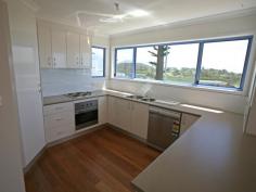  Bermagui NSW 2546 Enjoy ocean views from the living area and balcony or a short walk over reserve (opposite) to an unspoiled beach, yet right in town. Each townhouse has a large upstairs patio to soak up the ocean and reserve views and the smell of the seaspray and a single garage with internal access. Unit 4 includes a purpose built (huge) boat store garage design for big boats, caravans or storage. A really lovely outlook in an outstandingly convenient location. Don't delay inspect today. 