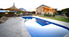  32 Glenabbey Dr Dubbo NSW 2830 Auction 06/11/2014 at 6:00 PM Property: House 	 Bldg: Cement Rendered 	 Land: 2525 Sqm 	 Council: Dubbo 	 Pool: Yes 	 Age: 9 	 Rooms: Lounge/Living Office Rumpus Room Family Room Dining Room 	 Other Areas: Laundry Area- Internal Formal Entry Walk-in-Pantry Courtyard 	 Complex: Barbecue Area 	 Furnished: N 	 Majestic Family Home with Scenic Views Positioned in prestigious Kintyre Estate offering beautiful panoramic views over Dubbo and the Harvey Ranges, this luxurious property with grand proportions is nestled on a peaceful 2,525 sq m block (approx).  The sheer vastness of the family home is immediately impressive with a collection of three living areas, four generous sized bedrooms plus office or fifth bedroom and large elevated entertaining patio overlooking the solar heated inground pool. If you are looking for a lifestyle that affords living without compromise, you must simply inspect this property.  Features: - Four oversized bedrooms - Stunning master retreat includes dressing room/walk-in robe and beautiful ensuite - Office or fifth bedroom - Lavishly appointed bathroom - Centrepiece formal lounge room with magical views - High gloss kitchen overlooking the family and dining areas with vaulted ceiling and views - Huge downstairs games room with impressive bar/kitchenette and third bathroom - Laundry offering loads of storage - Zoned, ducted reverse cycle air conditioning - Natural gas points - North East facing, elevated entertainers patio with superb views - Inground, solar heated pool with entertaining terrace - Landscaped yard providing privacy and including rear utilities storage and fire pit area - Three car garage with auto doors (one bay currently fitted with storage shelving) - Built by Rod Dunkley and hand picked tradesmen - Town water, tank water, town sewer, underground 3-phase power available - Peaceful retreat on a 2,525 sq m (approx) parcel - Elevated views over Dubbo, Harvey Ranges and zoo - Short drive to Dubbo Golf Course, cycleway, private and public schools, Delroy Park Shopping Centre, Woolworths Supermarket and CBD amenities The information and figures contained in this material is supplied by the vendor and is unverified.Potential buyers should take all steps necessary to satisfy themselves regarding the information contained herein. 