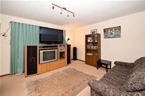  1/25 Greenwood Drive, St Agnes SA 5097 Currently tenanted (til 19/01/2015) at $230.00 per week this solid brick unit, one of just two, offers the opportunity of an affordable investment in a tidy rental property or first home. The single carport under the main roof has handy rear access to the good sized backyard complete with attractive paving, lawn area, garden shed and a small pergola like structure. The interior is neutral toned and comprises a carpeted lounge with a reverse cycle air-conditioning wall unit. It flows through to the separate dining area and the adjacent kitchen which is nicely equipped with an all in one cooker, overhead/under bench cupboards and laminate flooring. This flooring also features in both bedrooms as do mirrored built-in robes and a ceiling fan in the main. Both share a neat, light coloured tiled full bathroom. A separate laundry with built-in cupboard and backyard access completes the floorplan. This solid and more private unit, as it adjoins just one other, should ideally interest investors, first home buyers and downsizers. Conveniently close to St Agnes shopping centre, Tea Tree Plaza and public transport. It's well worth inspecting. 