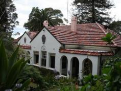 9 Elizabeth Pl Brookvale NSW 2100 Art Deco Spanish Mission Home On 1732m Block "Milroy" is without a doubt Brookvale's only iconic and historic example of inter-war Spanish Mission home with elements of ocean liner style and most of its original features intact - perfect for those looking for a property with distinctive flair and design. This full brick, strategically situated residence stands on a massive 1732m double block of land in a quiet cul-de-sac - conveniently located within walking distance from Warringah Mall; Brookvale shops, Brookvale Oval (home to the Sea Eagles); multiple educational institutions, and a short drive from the fabulous beaches that the peninsula has to offer; including Curl Curl; Dee Why and Manly... "seven miles from Sydney, and a thousand miles from care." The main house abounds with distinctive features, fireplaces, joinery, elaborate ceilings and cornices; and polished hardwood and cypress floors. The main living quarters are upstairs, including: Three bedrooms - a large one with twin built in wardrobes and recessed wall arches; a second bedroom with 5 windows overlooking the garden; and a third room with large built-in wardrobe and another small room annexed to it, suitable for a walk-in wardrobe, nursery or study. 