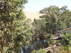  52 Walter Willis Bridgetown WA 6255 150 acres of rural bliss with 1.1km of river frontage and 2 homes! 
 
This property is located only 7km from Bridgetown. With a very cosy 2 
Storey, 4 bedroom home with amazing Blackwood River and valley views. 
This property offers total seclusion 
 
The main home has an open plan kitchen/dining area which adjoins the 
10x4m deck, ideal for alfresco dining and entertaining, 3 bedrooms also 
on the upper level all with built in robes. Downstairs provides a large 
living room with huge character stone open fire place and guest bedroom 
with French doors leading onto the lower entertaining area also with 
amazing river views. Satellite TV is available in both the upper and 
lower levels. 
 
The original homestead (circa 1890) has a new roof and offers 3 
bedrooms, lounge room with French doors leading to the wide return 
veranda's, the kitchen also has the original character wood stove. This 
home has sweeping views and is also set on the banks of the Blackwood 
River 
 Read more at http://bridgetown.ljhooker.com.au/42EGM2#jFV6D0b0gPHJ2JhT.99 