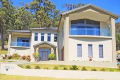  Laurieton NSW, 2443 Indulge Yourself This breathtaking residence is a monument to intuitive design and cutting edge sophistication. Epitomising a luxury lifestyle with flawless finishes and a wealth of formal and informal entertaining areas. The outstanding views take in Queens Lake to the Comboyne Plateau. * 460sqm of home and garaging (over 49 squares) * Huge gourmet kitchen with dual oven and walk in pantry * Main bedroom with outstanding views and private balcony * Private al fresco dining off family room * Formal lounge with views and deck * Fully landscaped, low maintenance block * Theatre room for the sports and movie lover * Extremely low running costs and energy efficient including - full insulation in all walls and ceiling - inverted 3kW Solar Electricity system - town and tank water (22,500 litre water tank) - inverted ducted air conditoning - gas boosted solar hot water system Words do not do this property any justice. Genuine inspections are welcomed by appointment. We have obtained all information from sources we believe to be reliable; however we cannot guarantee it's accuracy. Prospective purchasers are advised to carry out their own investigations. 