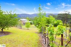 274A Hermitage Road, KURRAJONG HILLS NSW 2758 Property Information Wonderfully private and perfect for those wanting an acreage lifestyle with the convenience of Sydney CBD only 50 minutes away. The first stage of the home has been completed and provides an enviable indoor/outdoor lifestyle. Boasting a modern open plan interior with bi-fold doors flowing to gorgeous park like grounds and gardens. All finishes are of the highest quality, with high ceilings, ducted air conditioning and galley style kitchen.  A fully equipped outdoor stainless steel kitchen boasts quality European appliances including dishwasher, gas cooktop , full oven, integrated BBQ, stone bench tops and sensational Pizza oven. Upstairs is a stylish fully self contained apartment with kitchenette, lounge and dining, modern bathroom, gas fireplace all with delightful mountain views. The grounds incorporate, level grassed areas, terraced gardens with dozens of fruiting tree species, established  cool climate trees and shrubs, vegetable gardens and picturesque dams with comprehensive  irrigation systems. The 9 acre block is fully fenced with quality fencing, and the property enjoys stunning mountain views. There is a oversized two car lockup garage with auto doors,  storage and workshop area plus additional carport and shedding. Extensive water storage (120,000lt +) Envirocycle waste water system. Plans for stage two are available for viewing upon inspection , and all infrastructure for that stage is already in place . This is an opportunity not to be missed. 