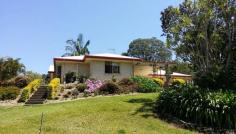  1  ( Lot 9 )  Annwal Lane Hunchy  Qld 4555 $599,000  This superb acreage in Hunchy delivers a relaxing country lifestyle and is sized to reap the benefits of sustainable living just 5 minutes from Palmwoods and Montville. The property features a comfortable and well maintained three bedroom brick home overlooking the picturesque grounds with fruit trees and vegie patch.   There is a large lock up shed, operational bore and 10,000 gallon rainwater tank at the base of the block. The house has rain water plumbed in and solar power.  Only minutes to Palmwoods and Montville, this property must be seen.  The owner says it is time to sell.  Features include:  1.5 acres of useable land with full equipped operational bore  3 bedroom, master with ensuite and walk in robe  Open plan kitchen, living and dining with split system air-conditioning  Ceiling fans throughout  Covered outdoor entertaining area with rollup blinds  2 door lock up remote control garage with in-house access  1.5kw solar power feed-in system  2 bay fully lockable steel shed with 3 phase power (includes welder, drill press, bench grinder, vice and benches) 