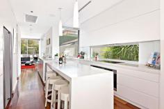  54A Burns Crescent Chiswick NSW 2046 sophisticated offering of unquestionable quality and refinement in a 
blue ribbon harbourside setting, this breathtaking residence is quite 
simply beyond compare. Flowing over three levels and finished to the 
highest of standards, panoramic views stretch across the bay to the 
distant skylines of North Sydney and the CBD. Occupying an elevated 
setting that embraces privacy and tranquillity and flooded with natural 
northern light throughout, this family home is designed for easy, low 
maintenance entertaining. An ultra-contemporary masterpiece of rare 
quality, it is minutes to parks and village life. 	Bright split level lounge and dining area, featuring in/outdoor ponds 	Marble tiled entertaining terrace, BBQ outlet and roof top garden 	Separate family room and theatre room / 4th bedroom with ensuite 	Generous master with walk-in robe, unique open ensuite with views 	Deluxe kitchen, CaesarStone island bench and glass splash-backs Sun-washed rear courtyard, sparkling lap pool with water feature Gas fireplace, heated tiled floor, polished timber and ducted air con 