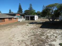  7 Manning St Manning Point NSW 2430 This is a rare opportunity to purchase a fully serviced building block centrally located at Manning Point. 
The block is situated one street back from the main street and within 
easy walking distance to the beach, river, Bowling Club and shop. 
The block has an area of 445m2, is fully serviced and improvements include a double lock up garage 