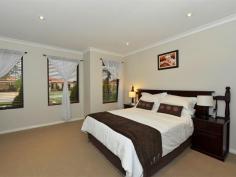  16 Strathalbyn Loop Carramar WA 6031 BURKE'S BACKYARD MEETS MASTERCHEF! Immaculately presented 4 bedroom 2 bathroom home with incredible chef's kitchen and impeccable manicured gardens. Warmth and ambience abound as you enter this home with blackbutt wood flooring and down lighting throughout. Absolutely huge bedrooms with large walk in robes (except bed 2 has BIR) and ducted air conditioning.  This home is every Stepford Wife's dream with gorgeous kitchen featuring glass splash backs, large wide drawers, overhead cabinets, 900mm stainless gas cook top, stainless steel oven and dishwasher with an over sized bench top for easy entertaining. Stunning family and meals area overlooks the gorgeous outdoor area. Double width sliding doors featuring timber blinds open out to stunning alfresco with timber decking and Designer wind down Blind. Enjoy endless summer days and balmy nights sipping wine on the timber decked pool surrounded by lush Hibiscus and fragrant Roses. The well manicured garden features additional grassed area, shed and a fabulous fruiting olive tree. Domestic bliss with masses of storage and laundry fitted with storage cabinets, built in trough and walk in linen closet. Overview of features: General Features Property Type: House Bedrooms: 4 Bathrooms: 2 Indoor Features Toilets: 2 Air Conditioning Outdoor Features Garage Spaces: 2 Open Car Spaces: 4 Other Features Built-In Wardrobes,Close to Schools,Close to Shops,Close to Transport,Garden,Alfresco, gas point 