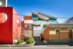  402/77a Little Oxford Street Collingwood VIC 3036 It's hard to believe that Collingwood's thriving cafe life is just around the corner from this serene light-filled apartment in a striking contemporary block with garden entrance, security, lift and basement garage. A brilliant design encompasses a spacious living and dining area open to a designer kitchen (quality cabinetry, stone benchtops, Nobel appliances) and flowing to a north-facing decked terrace with Collingwood views, a large double bedroom with BIRs and adjoining fitted study, plus sleek bathroom/laundry with dual basins. Features include richly polished timber floors and split-system air conditioning. 