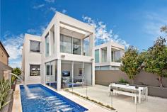  54A Burns Crescent Chiswick NSW 2046 sophisticated offering of unquestionable quality and refinement in a 
blue ribbon harbourside setting, this breathtaking residence is quite 
simply beyond compare. Flowing over three levels and finished to the 
highest of standards, panoramic views stretch across the bay to the 
distant skylines of North Sydney and the CBD. Occupying an elevated 
setting that embraces privacy and tranquillity and flooded with natural 
northern light throughout, this family home is designed for easy, low 
maintenance entertaining. An ultra-contemporary masterpiece of rare 
quality, it is minutes to parks and village life. 	Bright split level lounge and dining area, featuring in/outdoor ponds 	Marble tiled entertaining terrace, BBQ outlet and roof top garden 	Separate family room and theatre room / 4th bedroom with ensuite 	Generous master with walk-in robe, unique open ensuite with views 	Deluxe kitchen, CaesarStone island bench and glass splash-backs Sun-washed rear courtyard, sparkling lap pool with water feature Gas fireplace, heated tiled floor, polished timber and ducted air con 