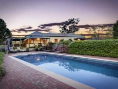 73 Phil Tunks Road, Dooralong The Epitome of Country Living 
			
			
				 Gracefully poised on approximately 31 amazing undulating acres is
 this stunning Dooralong Valley homestead. With a quintessential gated 
tree-lined drive that is embraced by manicured mature gardens and a 
generous outdoor decking from which to enjoy the stunning elevated rural
 outlook; the country life does not get any better than this. Charming 
warm interiors, French doors, stone kitchen and a dramatic sun-drenched 
central living/dining space provide a versatile and functional floor 
plan perfect for family living and entertaining. This incredible estate 
also flaunts a full sized tennis court, sparkling 12 metre solar heated 
in-ground pool, huge machinery shed plus stables and is all completely 
fenced. 