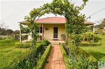 65 Little Scotland Rd Stanley VIC 3747 $279,000 Looking to get away, but still be close to town? You can have the best of both worlds with this tidy 3.5 acre property with a comfortable, ready to move in cottage. Situated only 500 metres from the historic Stanley Hotel and a five minute drive from thriving Beechworth township, this solid home features two bedrooms, lounge with wall air conditioning and efficient Maxiheat wood heater. The fully renovated kitchen is spacious and features a wood stove and a separate electric oven and cooktop, dishwasher and centre island bench. Adjacent to this is the meals area which leads out to the large open space of the property, with plenty of room for kids and animals to run, play and explore. There are two large, secure sheds on the property, the larger 12m x 9m (approx.) with power and concrete floor. This would make an ideal workshop or simply safe and secure car accommodation. Water will never be an issue with a reliable well and bore feeding both the house and garden as well as the established orchard of chestnut and assorted fruit trees. An original barn and shed provides greater room for storage. Suitably priced to sell, this property is a fantastic opportunity for the first time buyer to get into the market and add their own piece of charm to this lovely rural setting. 