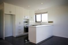  2/11 Isabelle Court Wynyard Tas 7325 Price: $269,000 WOW FACTOR An abundant in natural light with impressive finishes and open flowing floor plan are just a few of the features of this unit. Features include:- - 2 Generous sized bedrooms both with built-in wardrobes - Modern kitchen with wall oven, ceramic cooktop and dishwasher - Open plan living area which enjoys the afternoon sun and is heated by Daikin heat pump - Grey gloss tiles in kitchen, dining and bathrooms areas and high quality woollen carpet - Spacious bathroom with separate bath and semi frameless shower unit - Separate toilet - Remote single garage with internal access to the unit - Additional car parking at front of garage The unit is well positioned (only 2 on the block), fully fenced and private. Conveniently located, walking distance  to local amenities including Medical Centre, Shops, beach and walking tracks. Thinking of downsizing, call to organise an inspection. 