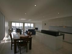  Bermagui   NSW   2546 Seaside living in the lovely village of Bermagui. This three bedroom townhouse is located right opposite an eco-wonderland beach reserve.  Be enthralled by the swans and birdlife on the natural lagoon opposite, or the breakers rolling in to the beach.  This townhouse offers stunning ocean and beach views to the north east.  The fully tiled first floor, accommodates the main living area opening to a front balcony, kitchen and guest toilet with hand basin and the double garage under the roofline which is at street level on the rear.  The carpeted ground floor has 3 bedrooms, main and ensuite bathrooms, laundry and a covered deck.  Affordable luxury and what a location to enjoy Bermagui with an easy bike/walking track to the shops or beach. 