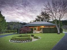 73 Phil Tunks Road, Dooralong The Epitome of Country Living 
			
			
				 Gracefully poised on approximately 31 amazing undulating acres is
 this stunning Dooralong Valley homestead. With a quintessential gated 
tree-lined drive that is embraced by manicured mature gardens and a 
generous outdoor decking from which to enjoy the stunning elevated rural
 outlook; the country life does not get any better than this. Charming 
warm interiors, French doors, stone kitchen and a dramatic sun-drenched 
central living/dining space provide a versatile and functional floor 
plan perfect for family living and entertaining. This incredible estate 
also flaunts a full sized tennis court, sparkling 12 metre solar heated 
in-ground pool, huge machinery shed plus stables and is all completely 
fenced. 
