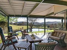 73 Phil Tunks Road, Dooralong The Epitome of Country Living 
			
			
				 Gracefully poised on approximately 31 amazing undulating acres is
 this stunning Dooralong Valley homestead. With a quintessential gated 
tree-lined drive that is embraced by manicured mature gardens and a 
generous outdoor decking from which to enjoy the stunning elevated rural
 outlook; the country life does not get any better than this. Charming 
warm interiors, French doors, stone kitchen and a dramatic sun-drenched 
central living/dining space provide a versatile and functional floor 
plan perfect for family living and entertaining. This incredible estate 
also flaunts a full sized tennis court, sparkling 12 metre solar heated 
in-ground pool, huge machinery shed plus stables and is all completely 
fenced. 