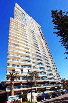  Surfers Paradise, QLD 4217 Ocean & Broadbeach Views Here is an opportunity to own a prestigious 2 bedroom (1+1) apartment in a stunning 30 level Raptis high-rise.  Each apartment has ducted personal control air-conditioning, spacious open plan living areas and generous balconies. The kitchens are fully equipped with quality European appliances. You will notice the high standard of finishes and inclusions throughout as well as acoustic treatments which exceeds Australian standards.  Facilities - Lifestyle and Recreation:  - Private theatre room for resident use  - Heated indoor merging outdoor swimming pool  - Spa  - Sauna  - Steam room  - Fully equipped gymnasium  - Virtual Golf simulation games room  - Poolside barbeque and entertainment area  Location:  - Located beachside in Surfers Paradise, 150 metres from the beach  - Contemporary design  - Ageless quality  - Sculptural form  - Lush tranquil landscaped gardens synonymous with Raptis developments  - Elegant entry with exclusive facilities to complete a quality lifestyle  - An easy stroll to Surfers Paradise shopping precinct and night life  - Minutes to Casino, Pacific Fair and the new Gold Coast Convention Centre. 