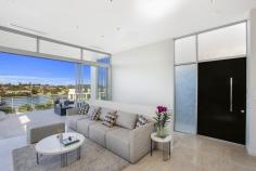  54A Burns Crescent Chiswick NSW 2046 sophisticated offering of unquestionable quality and refinement in a 
blue ribbon harbourside setting, this breathtaking residence is quite 
simply beyond compare. Flowing over three levels and finished to the 
highest of standards, panoramic views stretch across the bay to the 
distant skylines of North Sydney and the CBD. Occupying an elevated 
setting that embraces privacy and tranquillity and flooded with natural 
northern light throughout, this family home is designed for easy, low 
maintenance entertaining. An ultra-contemporary masterpiece of rare 
quality, it is minutes to parks and village life. 	Bright split level lounge and dining area, featuring in/outdoor ponds 	Marble tiled entertaining terrace, BBQ outlet and roof top garden 	Separate family room and theatre room / 4th bedroom with ensuite 	Generous master with walk-in robe, unique open ensuite with views 	Deluxe kitchen, CaesarStone island bench and glass splash-backs Sun-washed rear courtyard, sparkling lap pool with water feature Gas fireplace, heated tiled floor, polished timber and ducted air con 