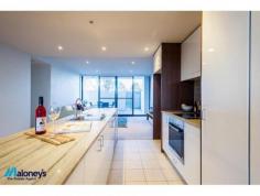  110 / 1 Mouat Street, Lyneham, ACT 2602 $529,000 Conveniently located in the highly sought after 'Axis' complex, this large, ground floor, 2 bedroom ensuite apartment features 104m2 of internal living space plus 81m2 of courtyards. Located within walking distance to both Lyneham & Dickson shops and the exciting new Braddon Precinct while still being 5 minutes' drive to the CBD, this property is a stand out. The light filled, expansive open plan living area features floor to ceiling windows & sliding doors that frame & lead directly onto the 2 large 43m2 north & south facing courtyards. With enough room to create an entertaining area with BBQ, dining table & additional greenery with pots & plants the outdoor balcony acts an extension to your living areas. The modern kitchen is beautifully finished & offers stainless steel appliances, dishwasher & stone bench tops with plenty of space to entertain & cook up a storm. 