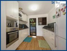  2/77 Railway Street, MUDGEERABA QLD 4213 Located privately, yet right in the centre of Mudgeeraba, this two 
bedroom single level very tidy villa enjoys elevated views and is 
located in a small complex in a bush setting. Features include: * 2 bedrooms * 1 bathroom * Open plan living with split system air-con & ceiling fan * Modern white galley kitchen * Easy care timber-look flooring through-out * Large rear covered courtyard * Covered off-street parking for one vehicle You'll
 love the convenience of being only a minute or two's walk from Coles 
and the Mudgeeraba Village Shopping Centre and just a few minutes drive 
to the M1 Motorway, Robina Hospital, Railway and Robina Town Centre 
Shopping. All this and the fact that single level & 
pet-friendly villas are highly sought-afer means this could be your 
perfect first home or investment (with a rental potential of $320 pw) - 
great buying that won't last long!   