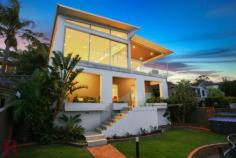  42 Fernleigh Rd Caringbah South NSW 2229 Ideally positioned in one of Caringbah South's most exclusive locations, this stunning architecturally designed residence offers breathtaking Burraneer Bay views. With an emphasis on contemporary style this home offers elegance and sophistication throughout. Superior appointments..no expense spared. An array of formal/casual entertaining areas. Four large bedrooms plus an open plan office and pool. A self contained area and parking for 3 cars. Land size 893 sqm. 