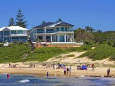  2 Werrina Parade Blue Bay NSW 2261 SUPERB BEACHFRONT PALATIAL RESIDENCE 
 Glamorous in design, mansion like in proportions and superb in 
quality. Absolute beach front, stunning architecturally designed 
residence situated on one of the Central Coast's most exclusive pockets.
 This property sprawls over two huge levels, designed for living on one
 level or two. Ground floor features a spacious living area with full 
kitchen, theatre room, guest bedroom, study / office, sauna, laundry and
 internal access to a massive four car garage whilst on the upper level 
huge living area, beautifully appointed kitchen, formal dining, 3 
bedrooms, main bedroom with ensuite & WIR, bathroom, wet bar and 
large entertaining balcony. Outdoors approx 1437m2 block, this home has
 a sensational inground pool, outdoor spa, entertaining areas and so 
much more! Read more at http://theentrance.ljhooker.com.au/EQYF7M#t60g0lfYkVwbTRGJ.99 