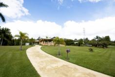  9 Curlew Crescent Cooroy QLD 4563 ENJOY THE SERENITY! Rolling lawns, neat gardens enhance this lovely traditional family home. This very large quality brick home only 10yrs old, is located very close to Cooroy town centre and sits on a fantastic 3399sqm easily maintained parcel of land. •    Quiet street location, can walk to Cooroy •    Nothing to do, extremely well maintained brick home •    Large generously proportioned rooms •    Very large master bedroom suite with WIR & open style en- suite •    Beautiful north facing  front verandah with open outlook •    Glorious kitchen with large island bench and granite tops •    Undercover parking to the side plus huge garage shed at the rear •    Tools, equipment and ride on mower offered with the sale of home •    Terrific family home on large accessible and usable  parcel of land •    Real value for money and only 15min drive to Noosa & attractions WON’T LAST LONG, DO NOT DELAY YOUR INSPECTION Watch our video for more photos and call Loretta Lehmann today. 