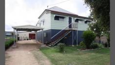  3 Hope Street, Warwick, QLD 4370 $220,000 This two bedroom plus sleepout home on two titles was raised and renovated after the 2011 floods. Featuring a good size lounge, adjoining lengthy sleepout, main bedroom with built-ins, new kitchen in attractive neutral tones, new carpets, modern bathroom and spacious laundry. The rear deck overlooks the huge backyard - plenty of room here. www.raywhiteruralwarwick.com.au Property ID: 781634 