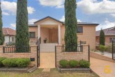  75 Macquarie St Greenacre NSW 2190 Fit For A King - DA approved for medical use!!!
 
 An exceptional entry into arguably Greenacres most prestigious 
locations, this quality built full brick home is set in a commanding 
position and boasts stunning city views. Featuring an impressive floor 
plan with sunlit formal lounge and dining and two separate family rooms,
 four double bedrooms, main with ensuite and a total of four bathrooms, 
high ceilings and stunning timber kitchen all finished to the highest 
standard. This large family home ideally suits a large family with 
double garage plus abundant storage space, sparkling in-ground pool, 
alfresco terrace and two balconies. All set on a large and level 613m2 
landscaped block close to shops and private schools. Also DA approved 
for a medical use. Sure to impress – Inspection highly recommended. 
 