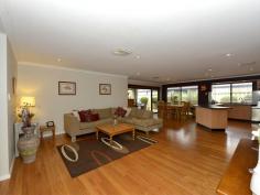  16 Strathalbyn Loop Carramar WA 6031 BURKE'S BACKYARD MEETS MASTERCHEF! Immaculately presented 4 bedroom 2 bathroom home with incredible chef's kitchen and impeccable manicured gardens. Warmth and ambience abound as you enter this home with blackbutt wood flooring and down lighting throughout. Absolutely huge bedrooms with large walk in robes (except bed 2 has BIR) and ducted air conditioning.  This home is every Stepford Wife's dream with gorgeous kitchen featuring glass splash backs, large wide drawers, overhead cabinets, 900mm stainless gas cook top, stainless steel oven and dishwasher with an over sized bench top for easy entertaining. Stunning family and meals area overlooks the gorgeous outdoor area. Double width sliding doors featuring timber blinds open out to stunning alfresco with timber decking and Designer wind down Blind. Enjoy endless summer days and balmy nights sipping wine on the timber decked pool surrounded by lush Hibiscus and fragrant Roses. The well manicured garden features additional grassed area, shed and a fabulous fruiting olive tree. Domestic bliss with masses of storage and laundry fitted with storage cabinets, built in trough and walk in linen closet. Overview of features: General Features Property Type: House Bedrooms: 4 Bathrooms: 2 Indoor Features Toilets: 2 Air Conditioning Outdoor Features Garage Spaces: 2 Open Car Spaces: 4 Other Features Built-In Wardrobes,Close to Schools,Close to Shops,Close to Transport,Garden,Alfresco, gas point 